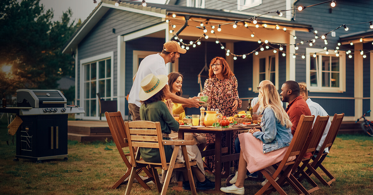 family enjoying dinner outside together