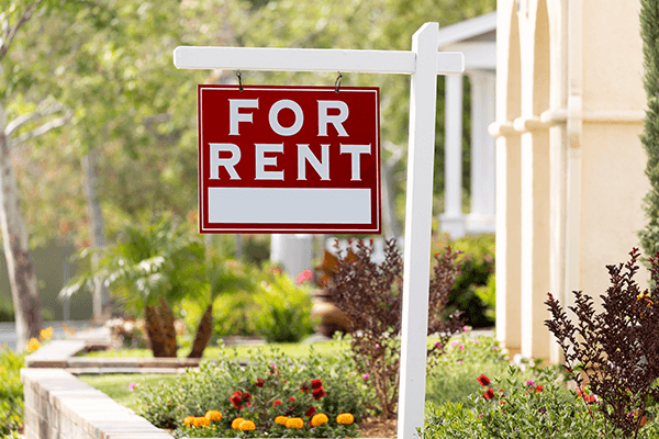 for rent sign in front of a rental property