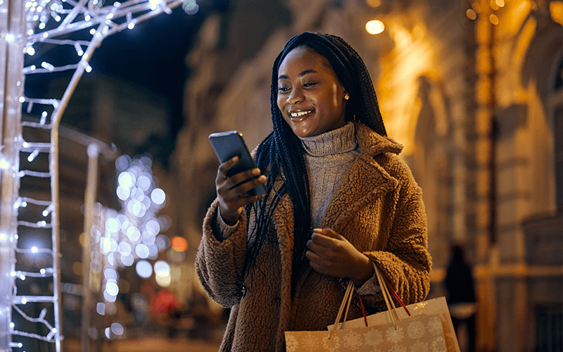 woman holiday shopping and mobile banking